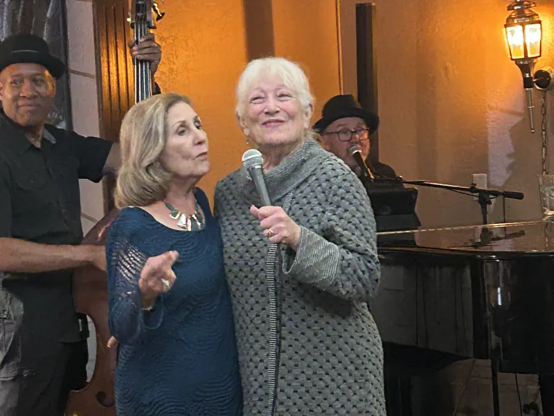 Two singers at the piano