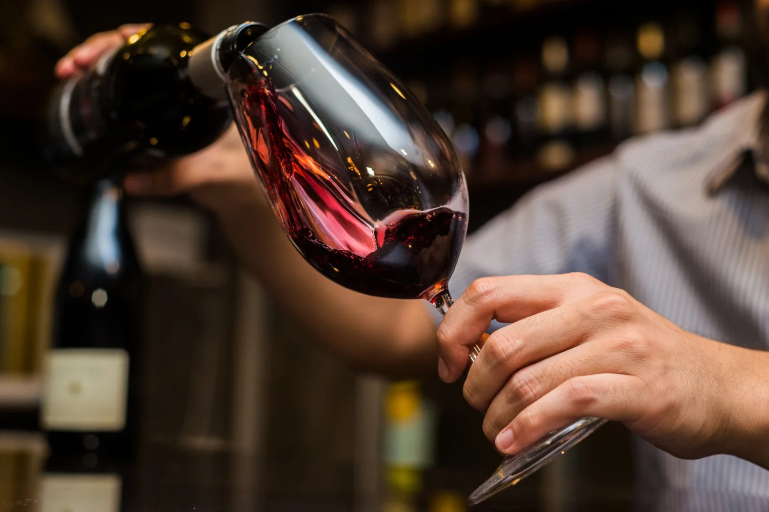 Red wine being poured into a glass